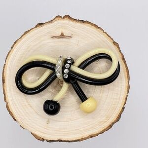 Vintage Celluloid Black Cream Rhinestone Accented Bow Pin Brooch